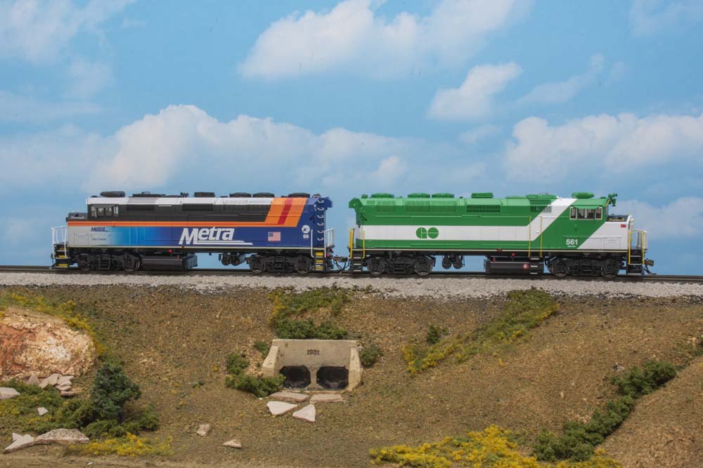 two different colored diesel locomotives