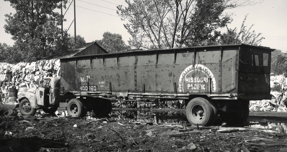 Black and white photo of a railroad hopper made into a truck.