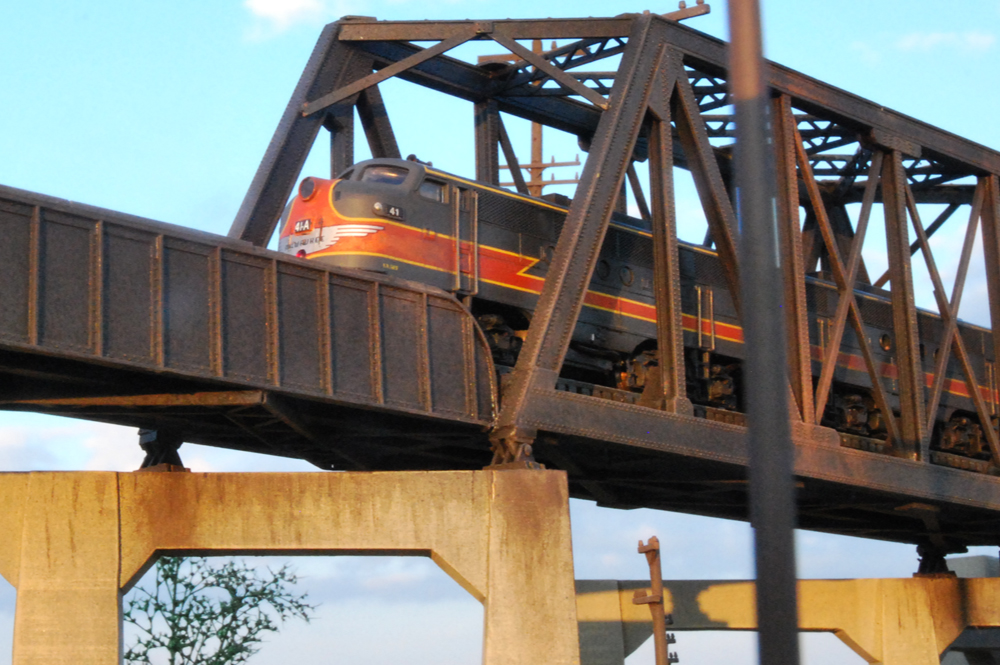 Diesel N scale locomotive on a high bridge