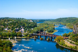 two train bridges over river