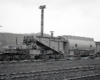 An extreme-duty train car used to carry electrical generating equipment.