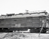 Side view of a modified gas-powered doodlebug with trolley pole.