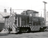 General Electric center-cab locomotive with trolley pole.