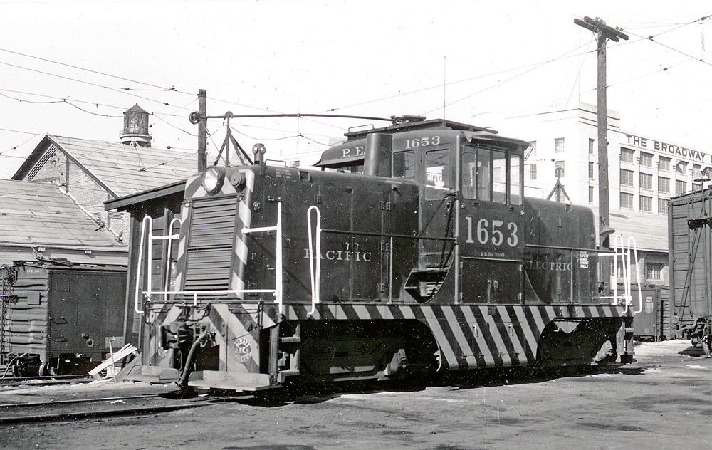General Electric center-cab locomotive with trolley pole.
