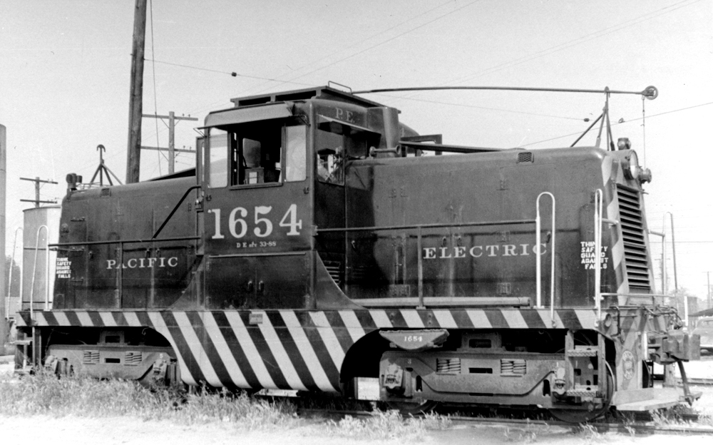 General Electric center-cab locomotive with trolley pole.