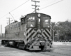 Baldwin diesel locomotive with trolley pole extended.