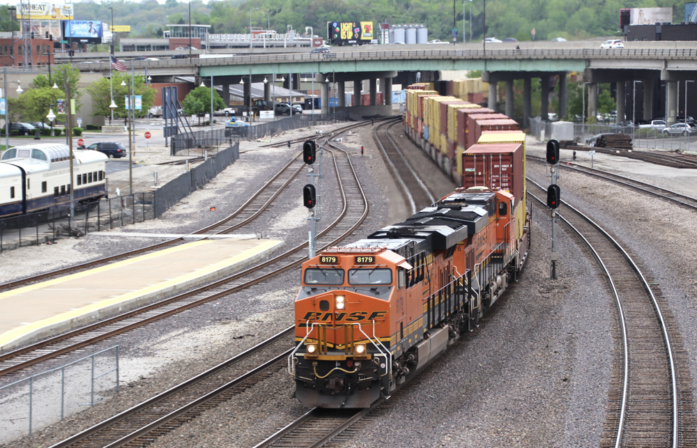 Train with double-stack container cars moves through S curve