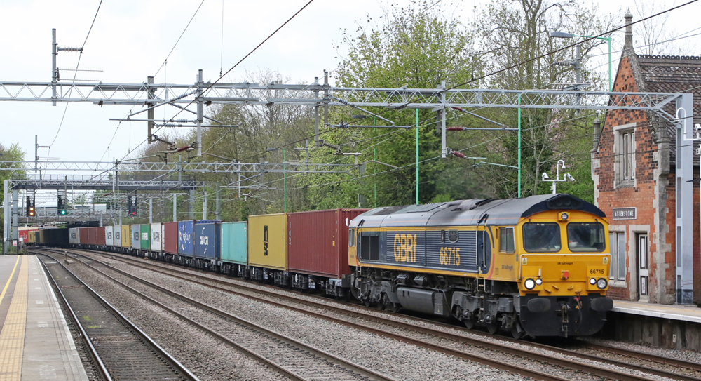 Flat-front blue-and-yellow diesel on freight train