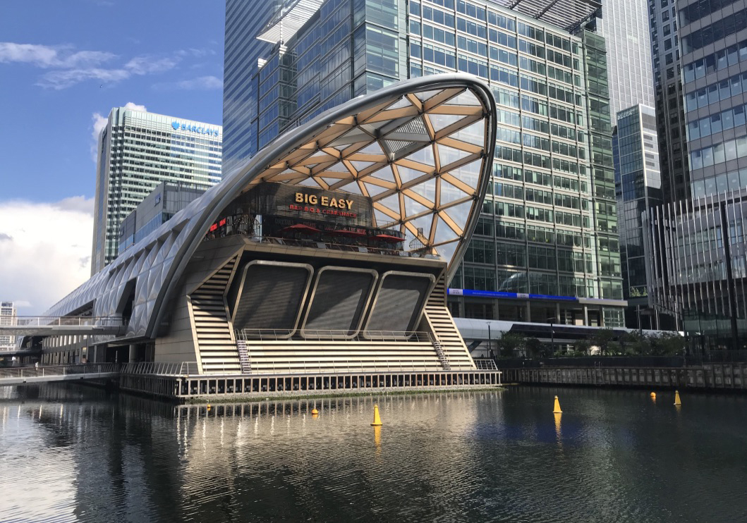 Transit station on water with skyline in background