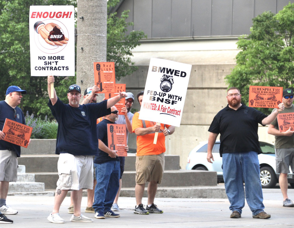 Men holding picket signs