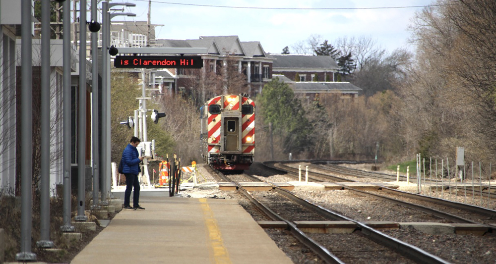 Metra train led by cab car approaches station