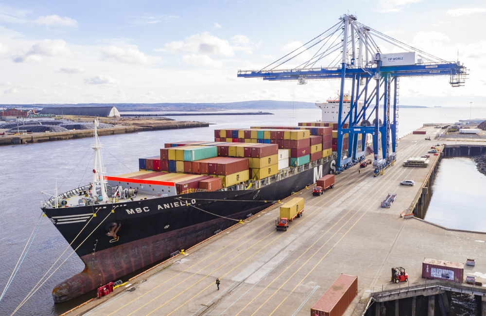 Ship at dock with container cranes