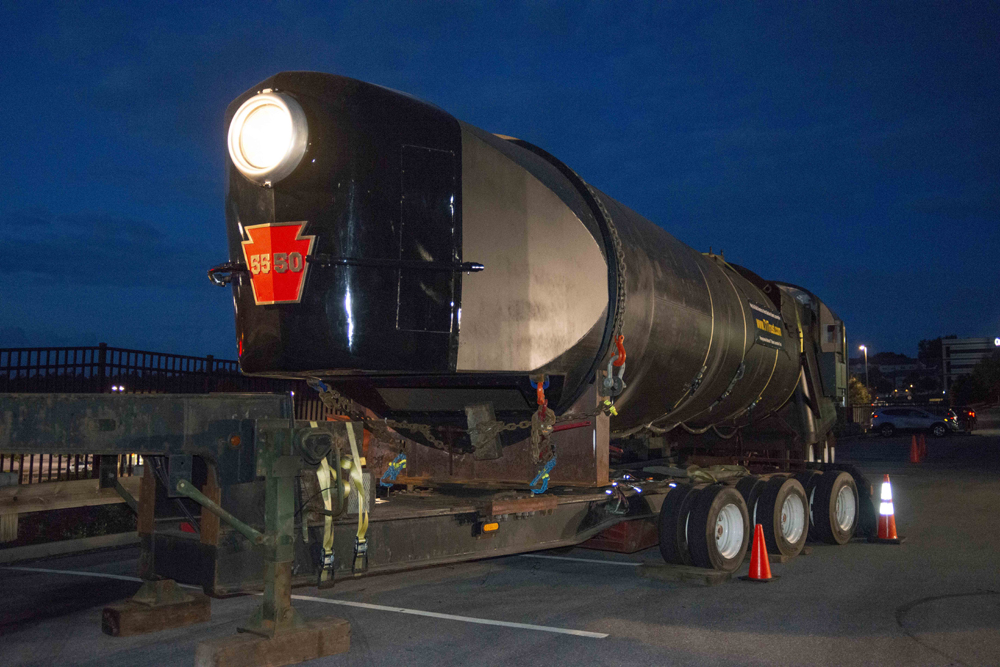 Partially completed locomotive with headlight illuminated