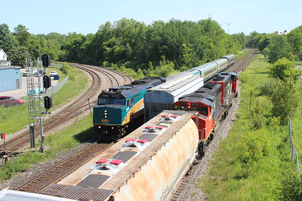 Passenger and freight train meet at junction