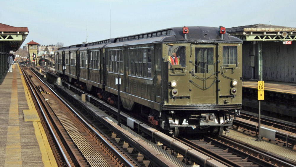 Green vintage subway cars in operation