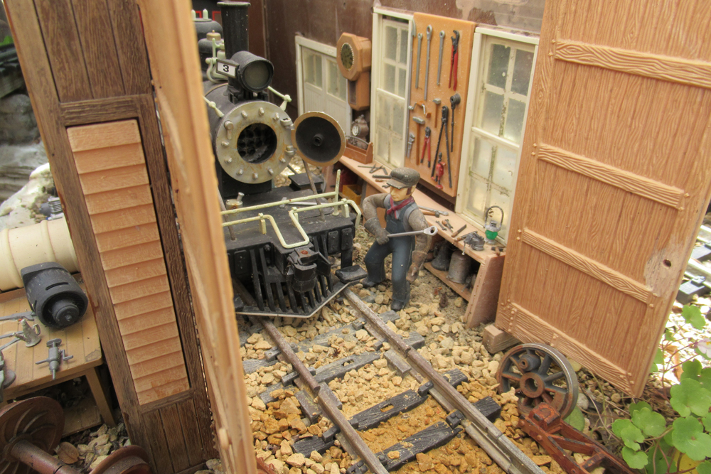 close up of model train engine shed