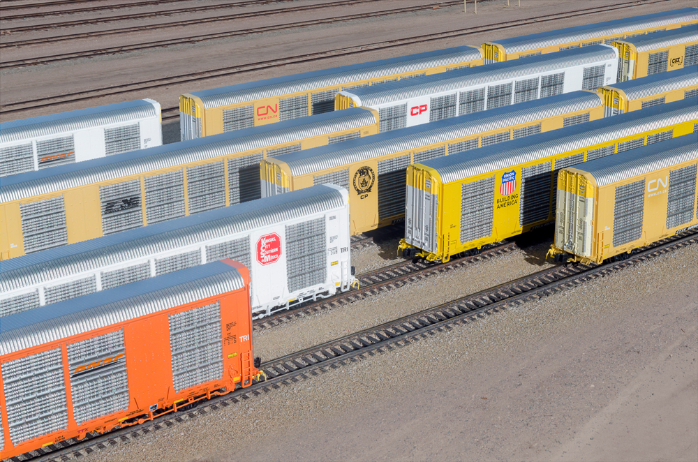 multiple freight cars in different colors