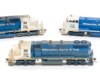 MR&T blue-and-white diesel locomotives: Photo of three locomotives on white background.