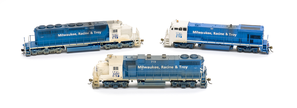 MR&T blue-and-white diesel locomotives: Photo of three locomotives on white background.