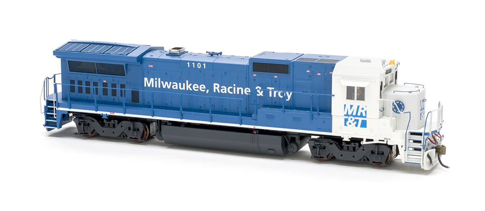 Photo of blue and white HO scale locomotive on white background