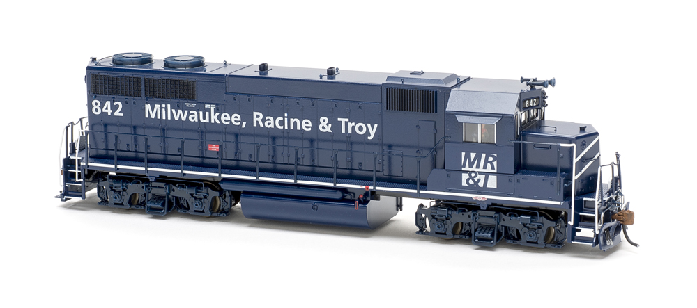 Photo of dark blue four-axle road locomotive in fresh paint on white background