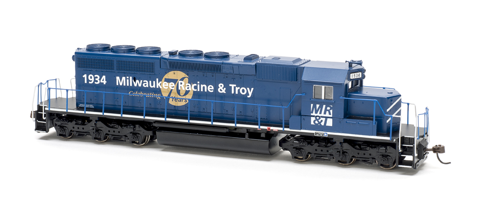 Dark blue six-axle road unit with white and gold graphics on white background
