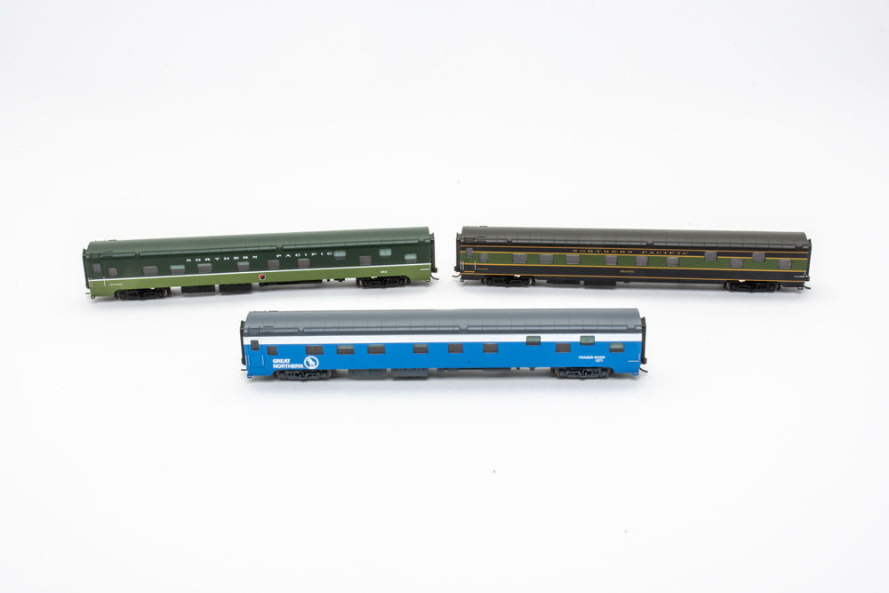 green and blue passenger cars
