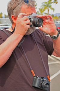 Railroad photographer with two cameras.