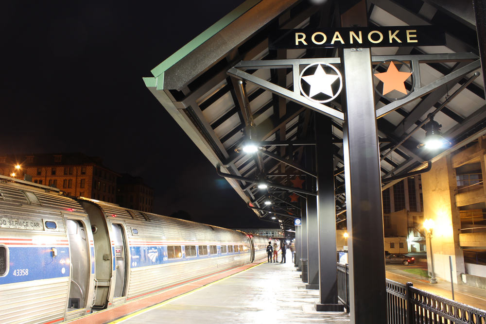 Train at station platform at night