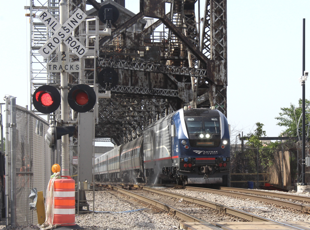 Train crosses steel-girder bridge