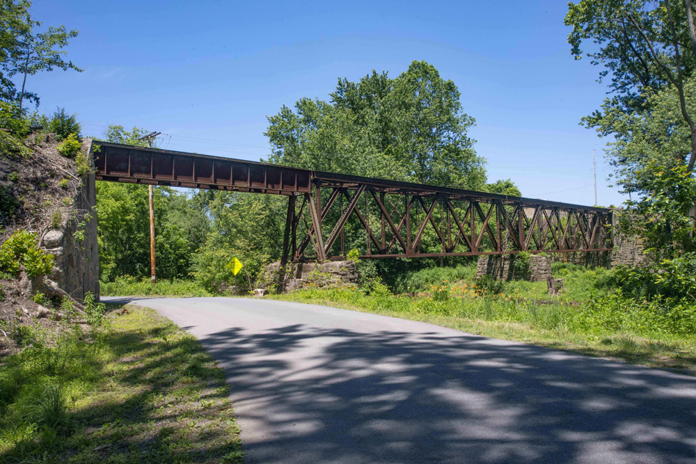 Steel railroad bridge over roadway