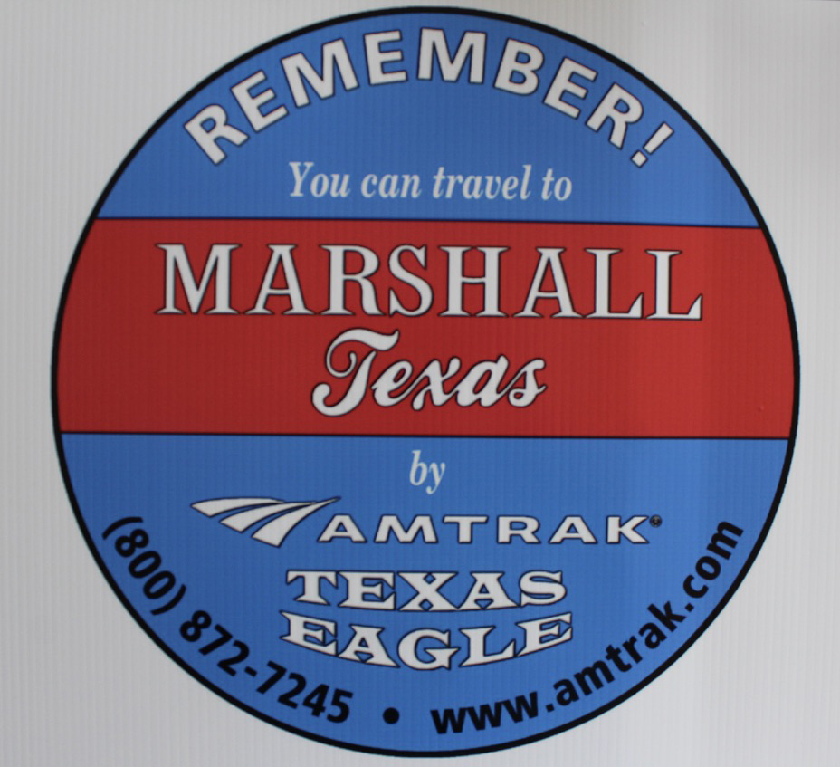 Circular logo promoting travel via the Texas Eagle