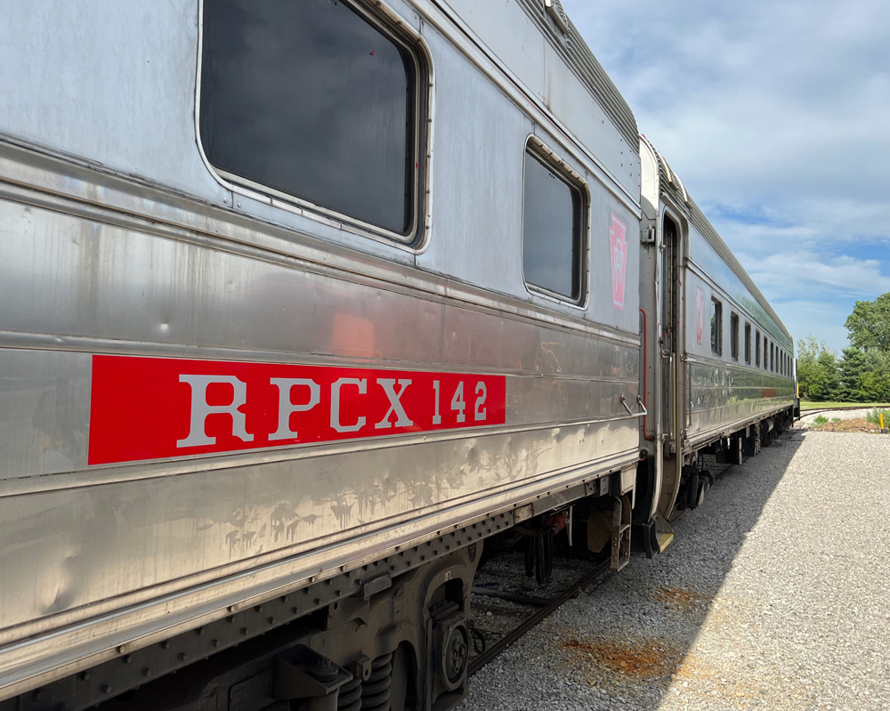 Two stainless steel passenger cars