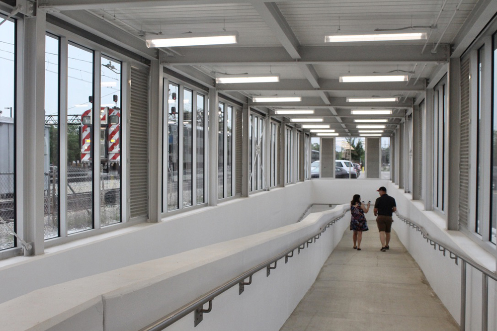 Long station handicap ramp in glass structure