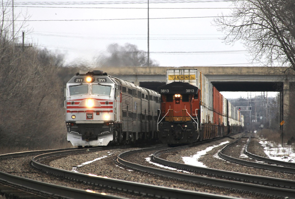 Commuter train passes end of intermodal train