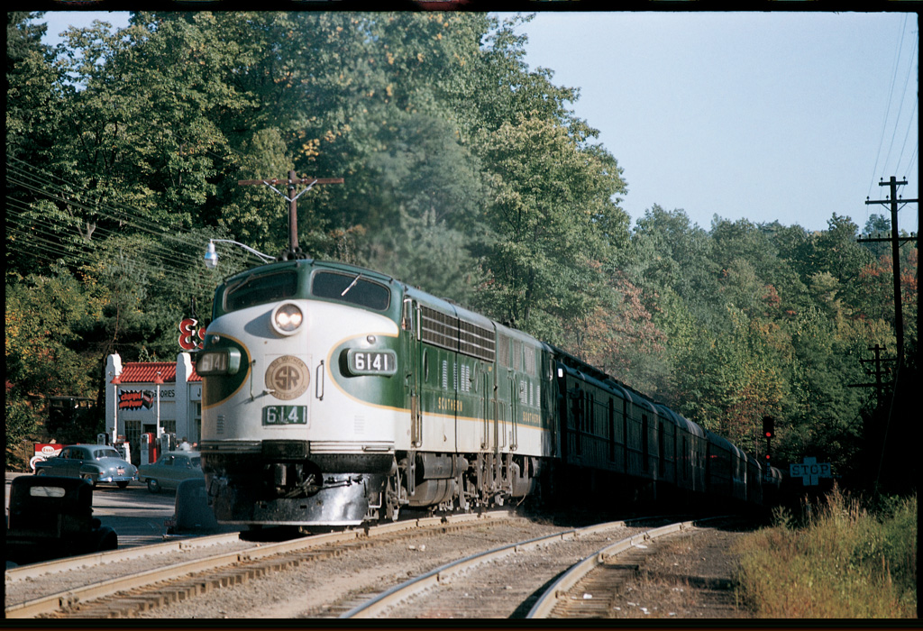 Green and white diesels at crest of mountain pass