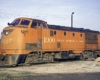 Streamlined red diesel locomotive with bulbous cab 