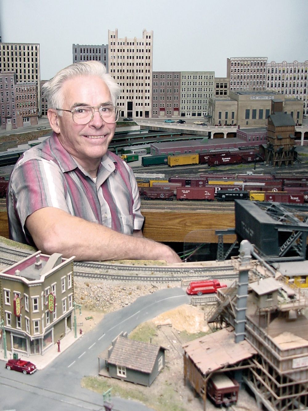 model railroaders we lost in 2022: a picture of a man by his layout