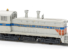 Photo of HO scale end-cab switcher on white background.