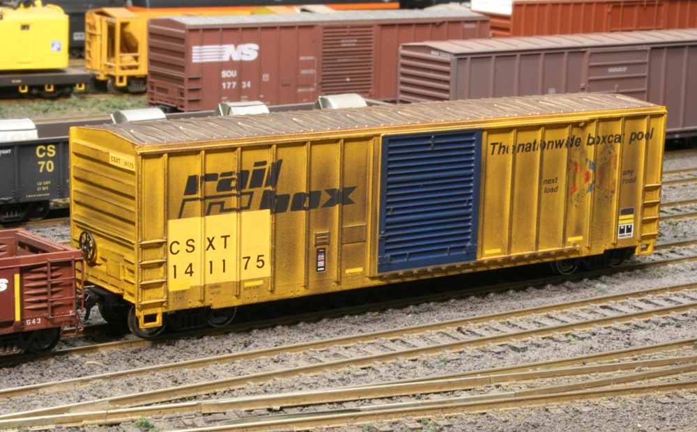 weathered yellow model boxcar