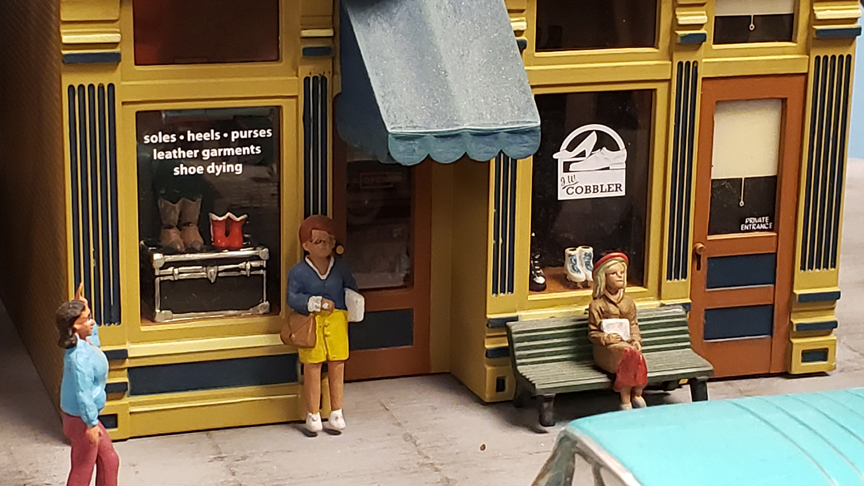 a storefront with shoes on display