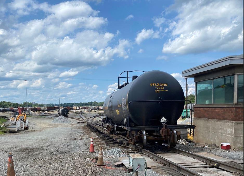 Freight car passing structure at top of hump in rail yard