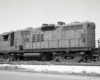 Black and white image of a locomotive on a track.