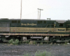 A color image of a black and yellow-striped locomotive.
