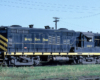 Color image of a black locomotive with yellow stripes