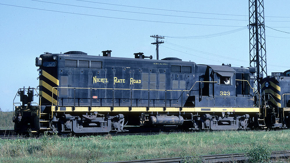 Color image of a black locomotive with yellow stripes