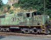 Color image of a green-painted and unusual cab locomotive.