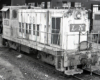 Black-and-white image of an end-cab locomotive.
