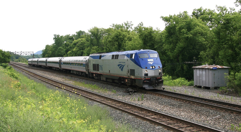 Passenger train approaches on double-track main 