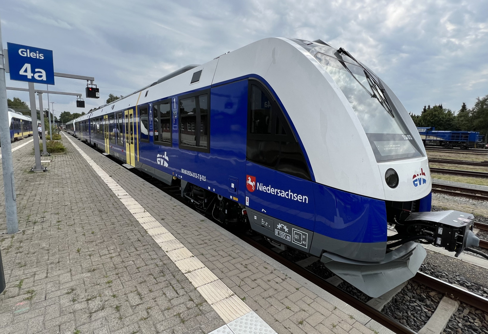 Blue and white two-car passenger train at station in Germany